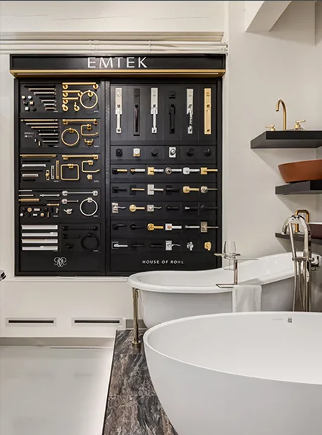 Emtek hardware display above a freestanding tub in the Baths by Design showroom