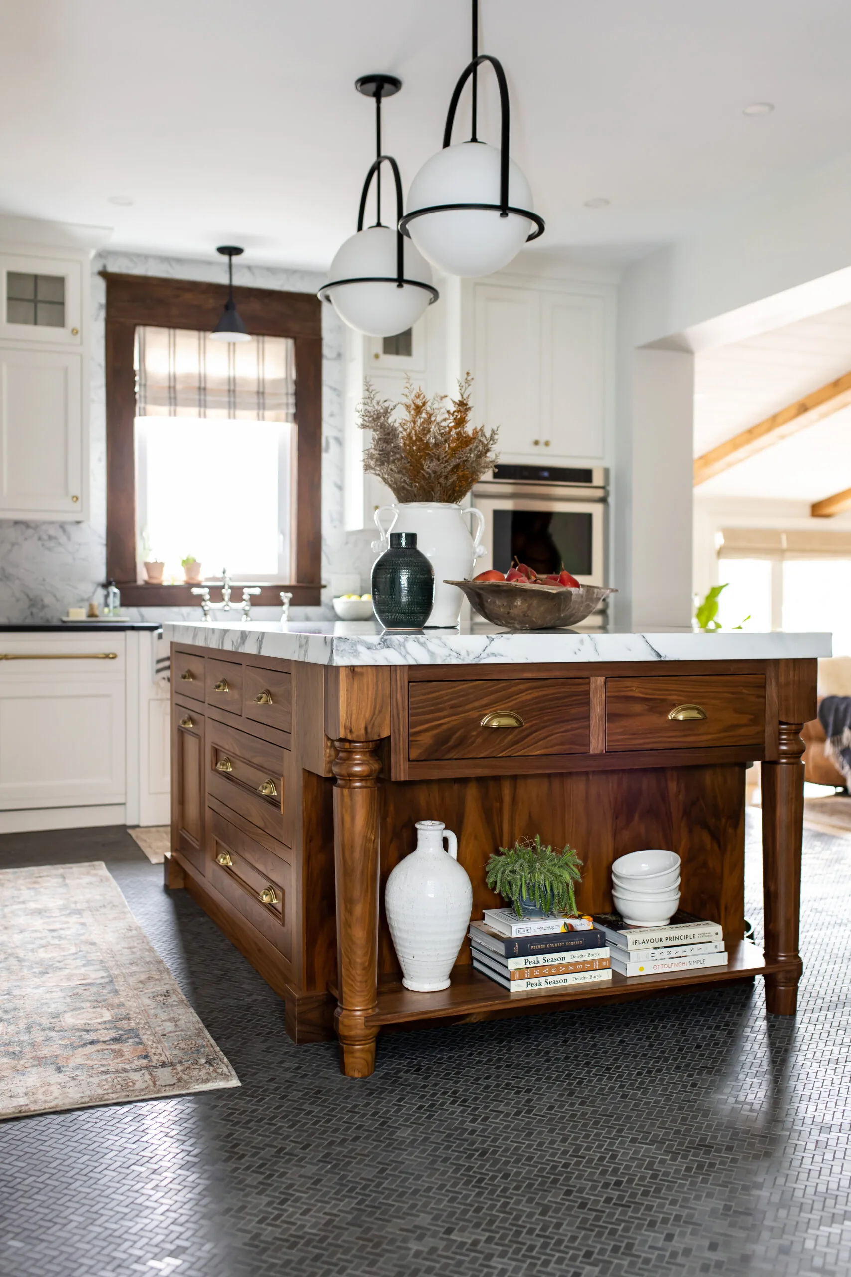Farmhouse kitchen with a large wood island and marble counters in Carolyn Wilbrink's project