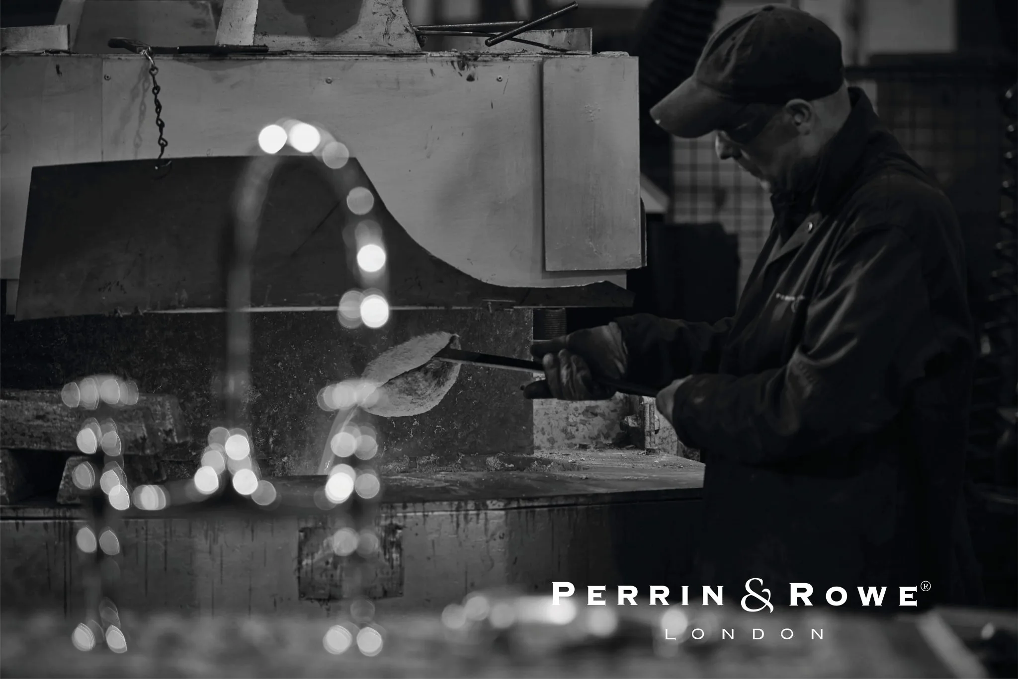Perrin & Rowe craftsman testing a handcrafted faucet in the workshop