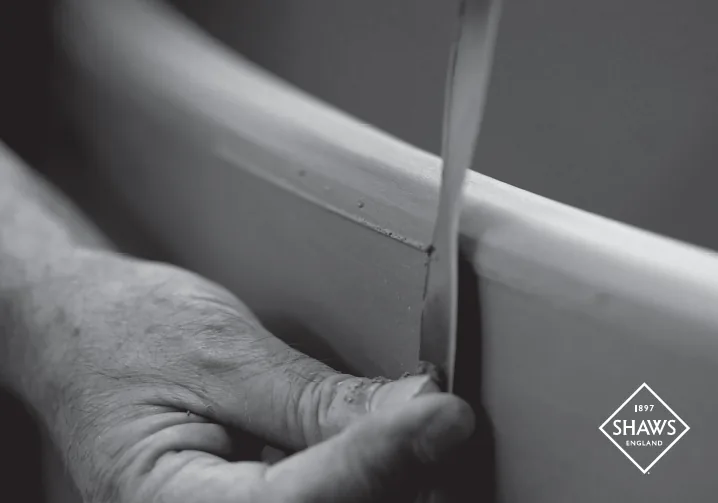 Shaws craftsman handcrafting a fireclay sink