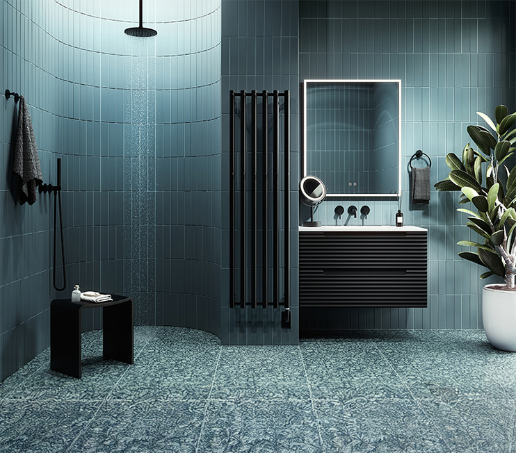 Luxury bathroom showroom display at Baths By Design Calgary featuring freestanding bathtubs, designer faucets, vessel sinks, and a House of Rohl fixture wall with marble backdrop.
